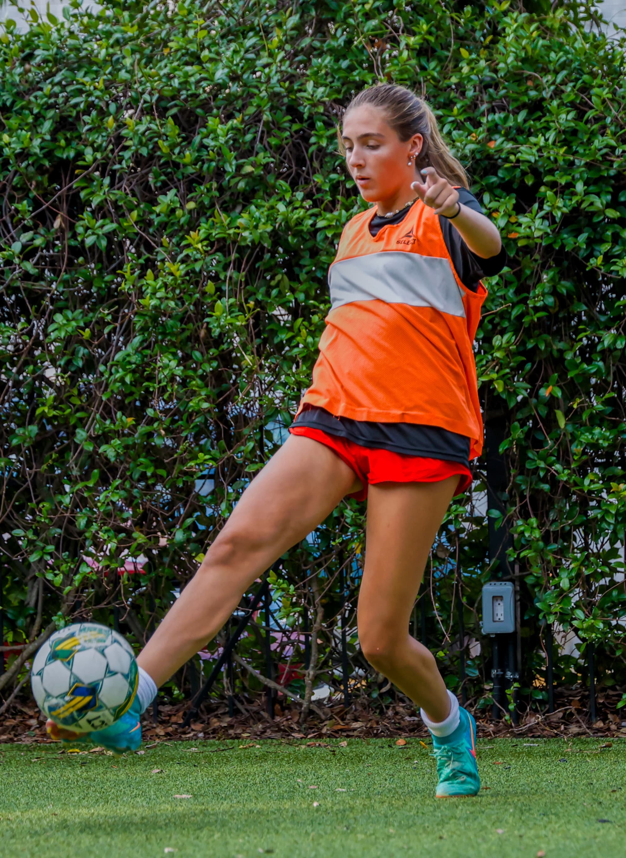 Teen player with ball