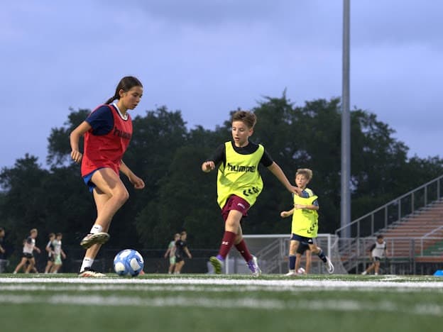 Pre-Teen City Soccer players contesting the ball at a 7's session